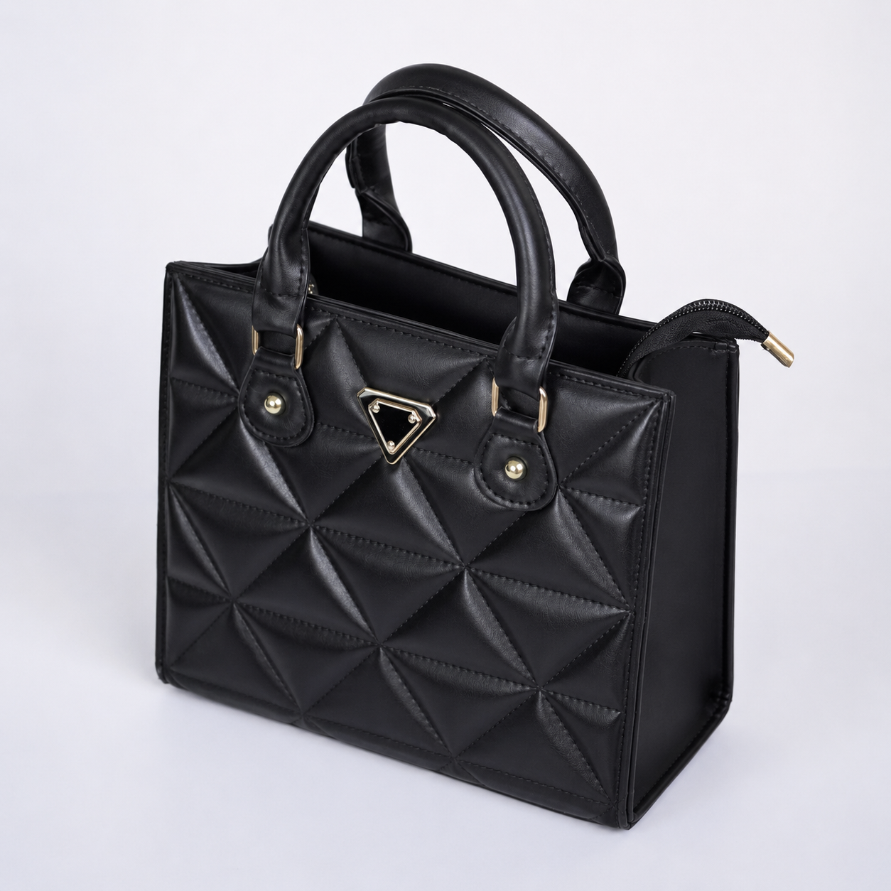 Bolso de mano MILÁN negro acolchado vista angular - CALÉA